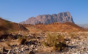 the 21 Bronze Age tombs of Al Ayn with the jagged, comb-shaped Jebel Misht behind ~ Oman