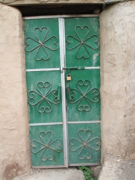 a green door in Misfat Al Abriyyen, Oman